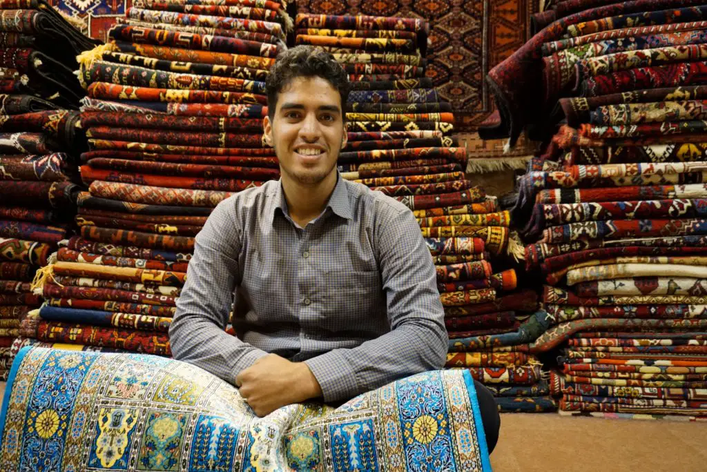 Ali, a carpet seller in the Bazaar, Isfahan, Iran – Experiencing the Globe