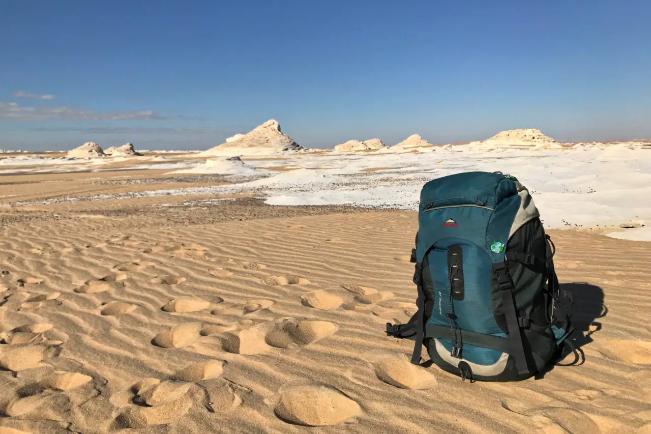 Backpack in the White Desert, Egypt - Experiencing the Globe