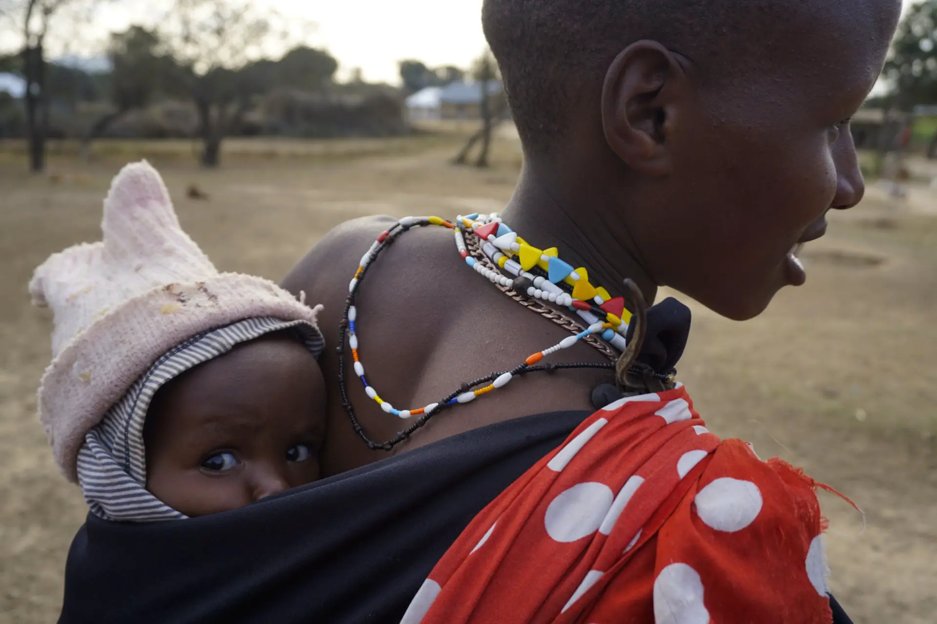 Masai woman with her baby, Tanzania - Experiencing The Globe